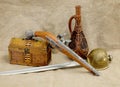 Bottle, rapier, sword, pistol and chest