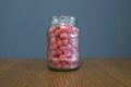 Red ripe fresh raspberry berry in a glass jar on a wooden table. Royalty Free Stock Photo