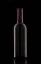 A bottle of red elite wine on a black background. Royalty Free Stock Photo