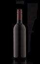 A bottle of red elite wine on a black background. Royalty Free Stock Photo