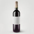 Bottle of red wine with blank label isolated on a white background Royalty Free Stock Photo