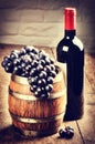 Bottle of red wine and bunch of grape Royalty Free Stock Photo