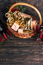 Bottle of red wine in Christmas basket. Royalty Free Stock Photo