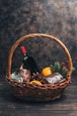 Bottle of red wine in Christmas gift basket