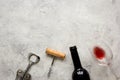 Bottle of red wine and corkscrew on stone background top view mockup Royalty Free Stock Photo