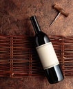 A bottle of red wine with an empty label on an old rough background Royalty Free Stock Photo