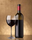 A bottle of red wine and filled a wine glass Royalty Free Stock Photo