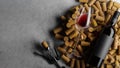 Bottle of red wine, wine glass, corkscrew on wine corks isolated on gray background. There are no people in the photo. There is a Royalty Free Stock Photo