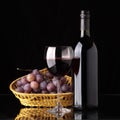 A bottle of red wine, glass and grapes Royalty Free Stock Photo