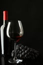 Bottle with red wine and glass and grapes Royalty Free Stock Photo