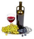 Bottle of red wine, glass and grapes - still life Royalty Free Stock Photo