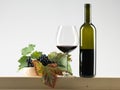 Bottle red wine, glass, grapes white background Royalty Free Stock Photo