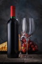 Bottle of red wine and two empty glasses close-up on a wooden table Royalty Free Stock Photo