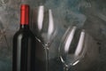 Bottle of red wine and two empty glasses Royalty Free Stock Photo