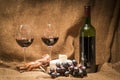 A bottle of red wine and two full glasses of wine Royalty Free Stock Photo