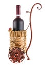 Bottle of red wine in wheeled basket Royalty Free Stock Photo