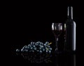 Bottle of red wine, wine glasses and grapes Royalty Free Stock Photo