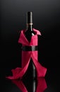 Bottle of red wine wrapped in crepe paper Royalty Free Stock Photo