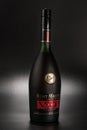 Bottle of Remy Martin cognac on black background