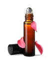 Bottle of rose essential oil and flower petals on white background Royalty Free Stock Photo