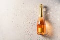 Bottle of rose sparkling wine on grey background Royalty Free Stock Photo