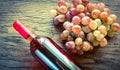 Bottle of rose wine with bunch of grape Royalty Free Stock Photo