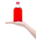 Bottle rosehip syrup in hand