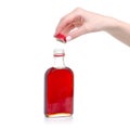 Bottle rosehip syrup in hand