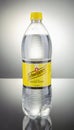 Bottle of Schweppes Indian tonic drink isolated gradient background. Royalty Free Stock Photo