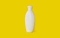 Bottle for shampoo on a bright yellow background Royalty Free Stock Photo