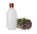 Bottle of shampoo and terry towel on white background Royalty Free Stock Photo