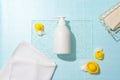 A bottle of shower gel is placed on a glass panel, surrounded by yellow silicone ducks. Simulating a sophisticated bathroom space