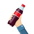 Bottle of soda hold in hand.