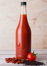 Bottle of spicy tomato juice with black pepper Royalty Free Stock Photo