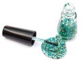 Bottle with spilled glitter nail polish on white Royalty Free Stock Photo