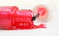 Bottle with spilled pink nail polish close up Royalty Free Stock Photo