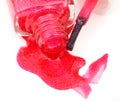Bottle with spilled red nail polish close up Royalty Free Stock Photo