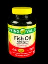 Bottle of Spring Valley Fish Oil Supplement on Black Backdrop