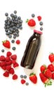 Bottle of strawberries, raspberries, blueberries juice isolated on white. Royalty Free Stock Photo