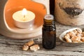 A bottle of styrax benzoin essential oil with benzoin resin and Royalty Free Stock Photo