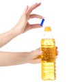 A bottle sunflower oil in hand