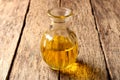 Bottle with sunflower oil on an old wooden table