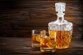 Bottle and two glasses with ice and whiskey Royalty Free Stock Photo
