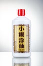 Bottle of typical strong chinese liquer isolated on gradient background.