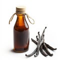 Bottle of vanilla extract is next to a bunch of vanilla beans Royalty Free Stock Photo