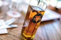 A bottle of vegetable oil infused with hot chili peppers on a table in a restaurant Royalty Free Stock Photo