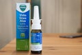 A bottle of Vicks Sinex Aloe nasal decongestant on a wooden table Royalty Free Stock Photo