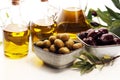 Olives. Bottle virgin olive oil and oil in a bowl with some olives Royalty Free Stock Photo