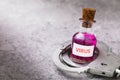 Bottle with a virus and handcuffs on a table with copy space