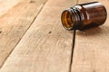 Bottle vitamins on wood background